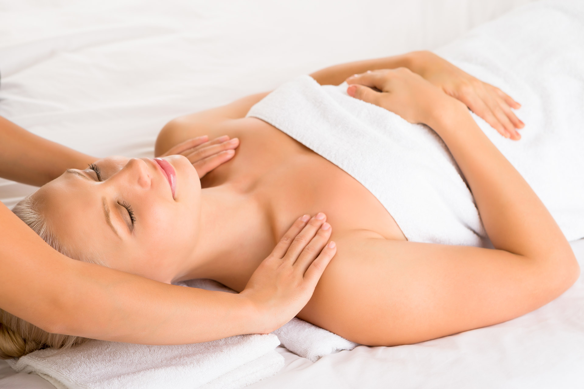 Beautiful-woman-with-eyes-closed-getting-massage-on-shoulder-658863954_5184x3456.jpg